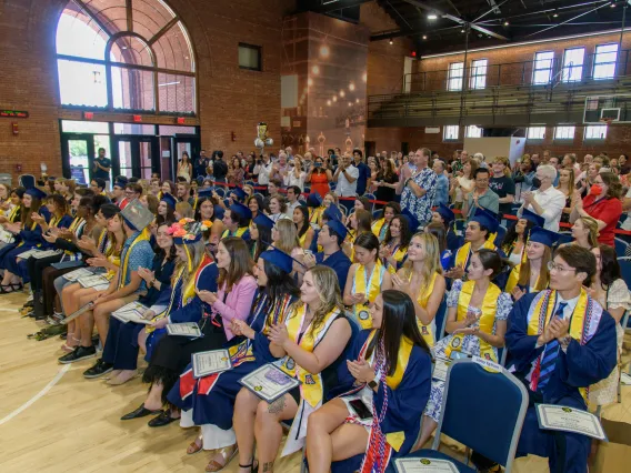 Spring 2023 NSCS Graduates assembled in Bear Down Gym