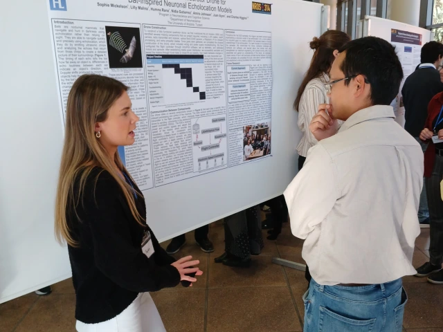 two people with poster