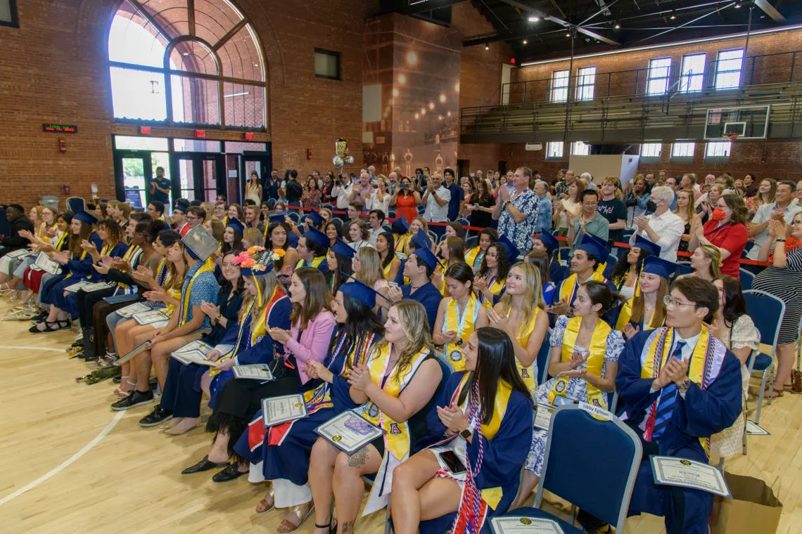 Spring 2023 NSCS Graduates assembled in Bear Down Gym