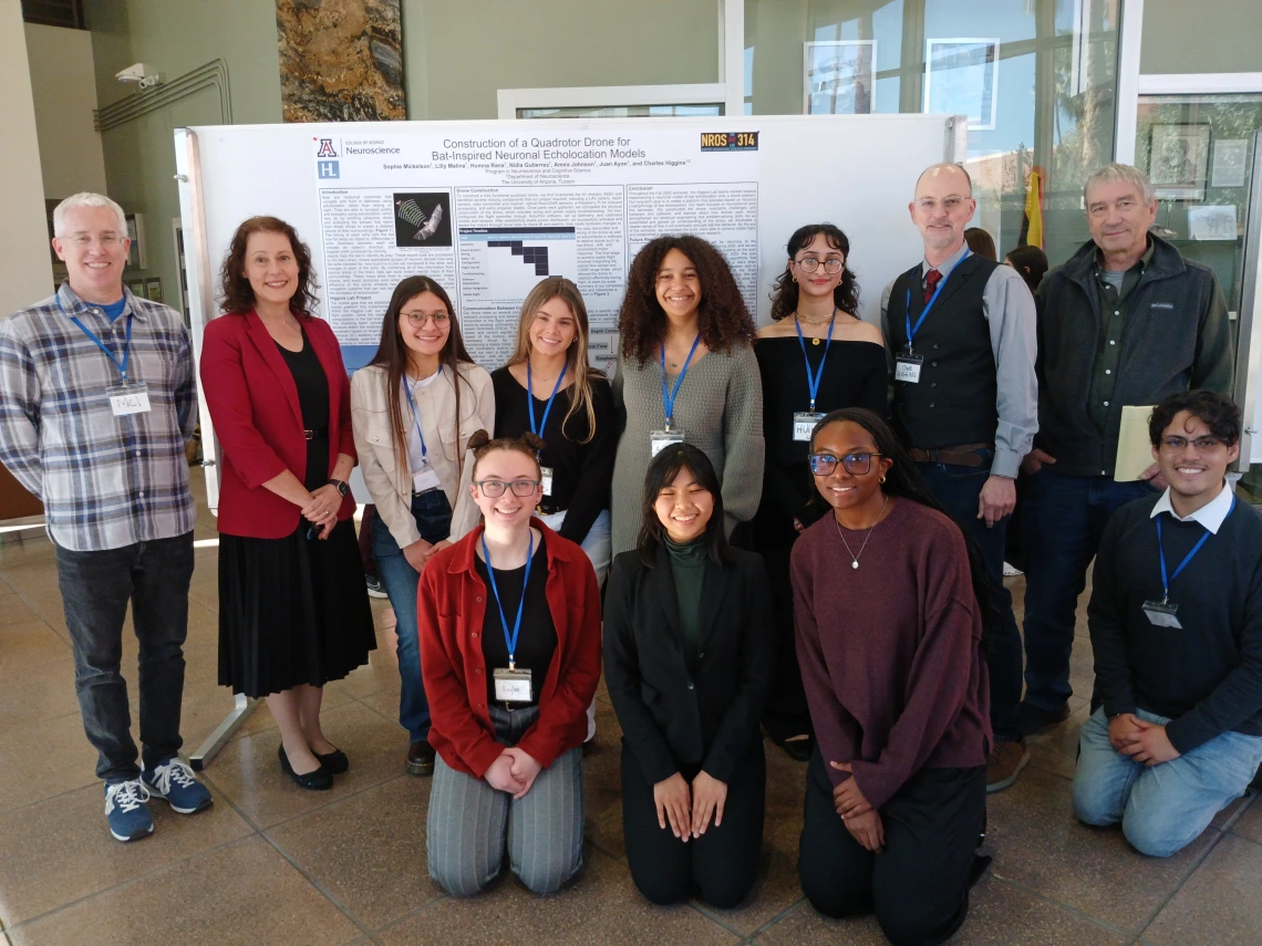 Students in front of poster