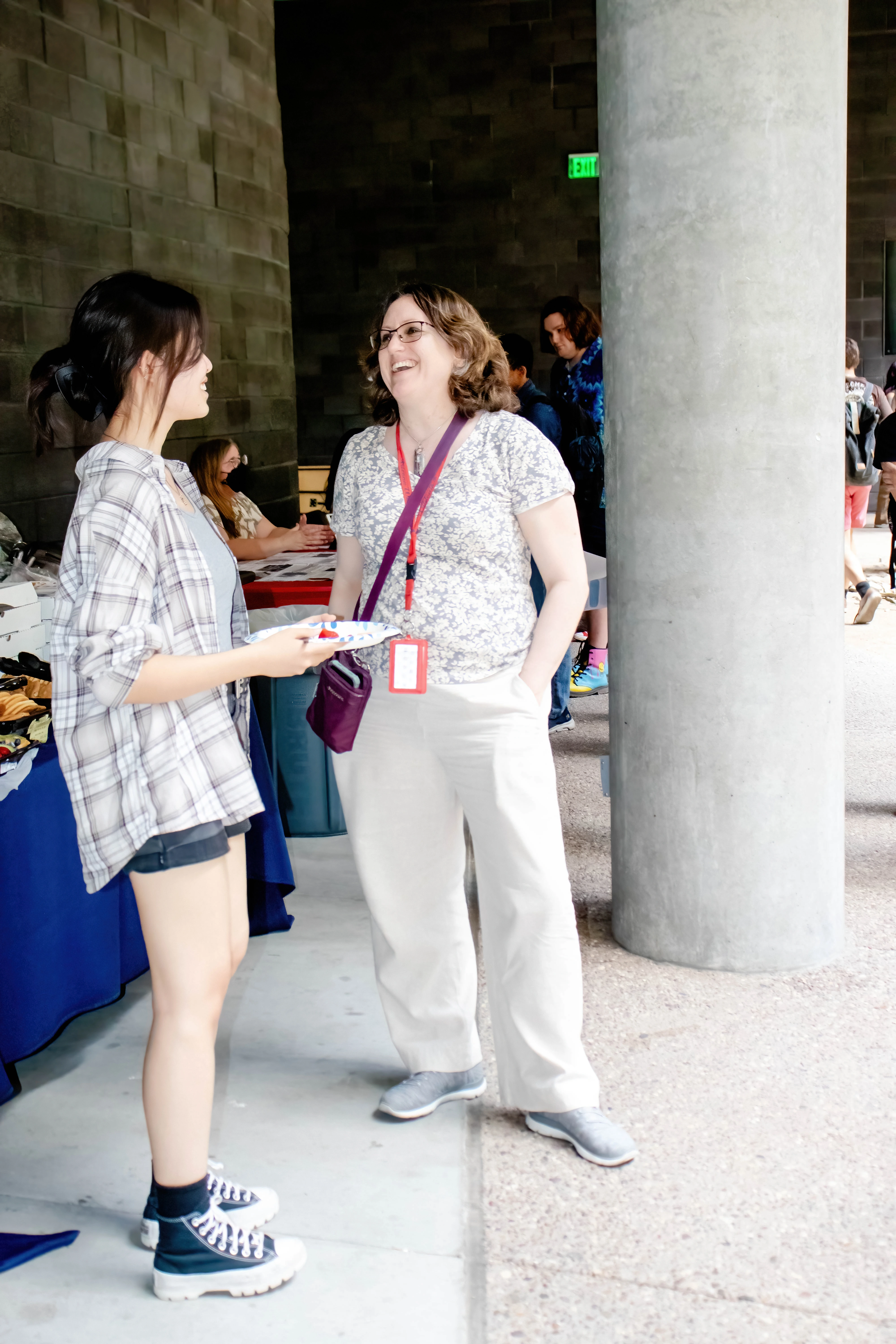 Dr. Miller interacting wih student in front of Koffler before Welcome Event