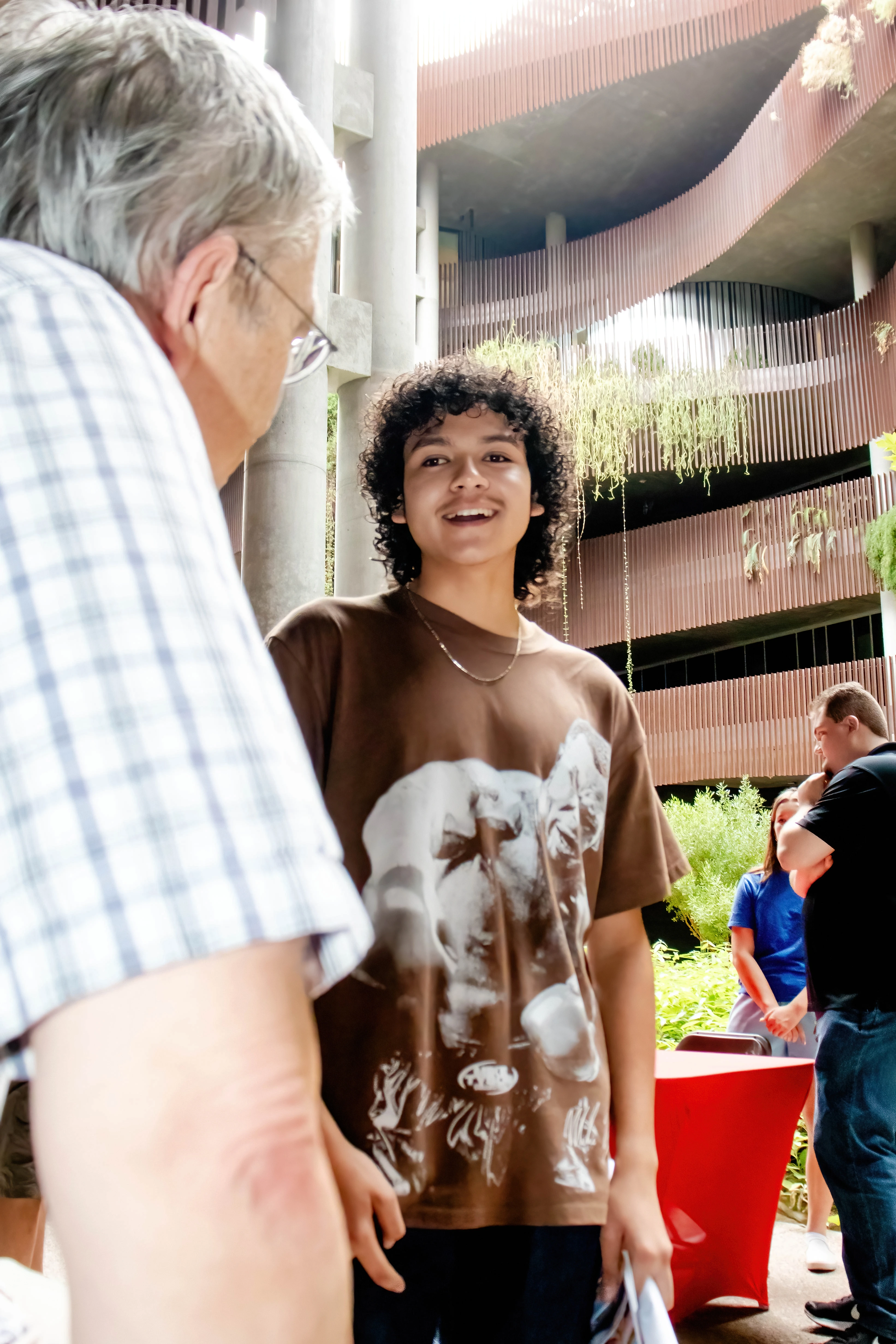 Dr. Zinsmaier interacting with student at Welcome Event