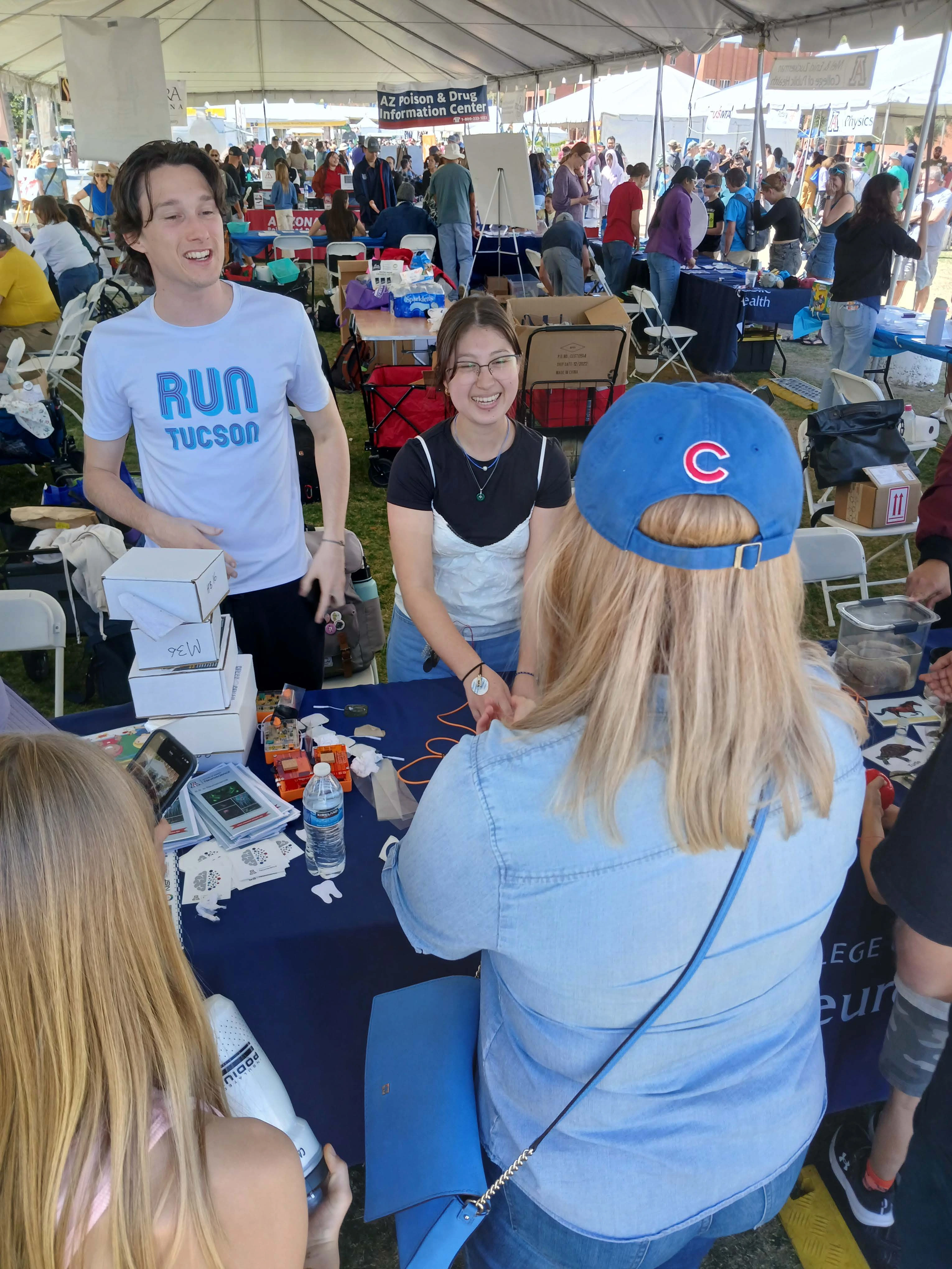 Neuroscience undergraduate Students at Science city interacting with another undergrad