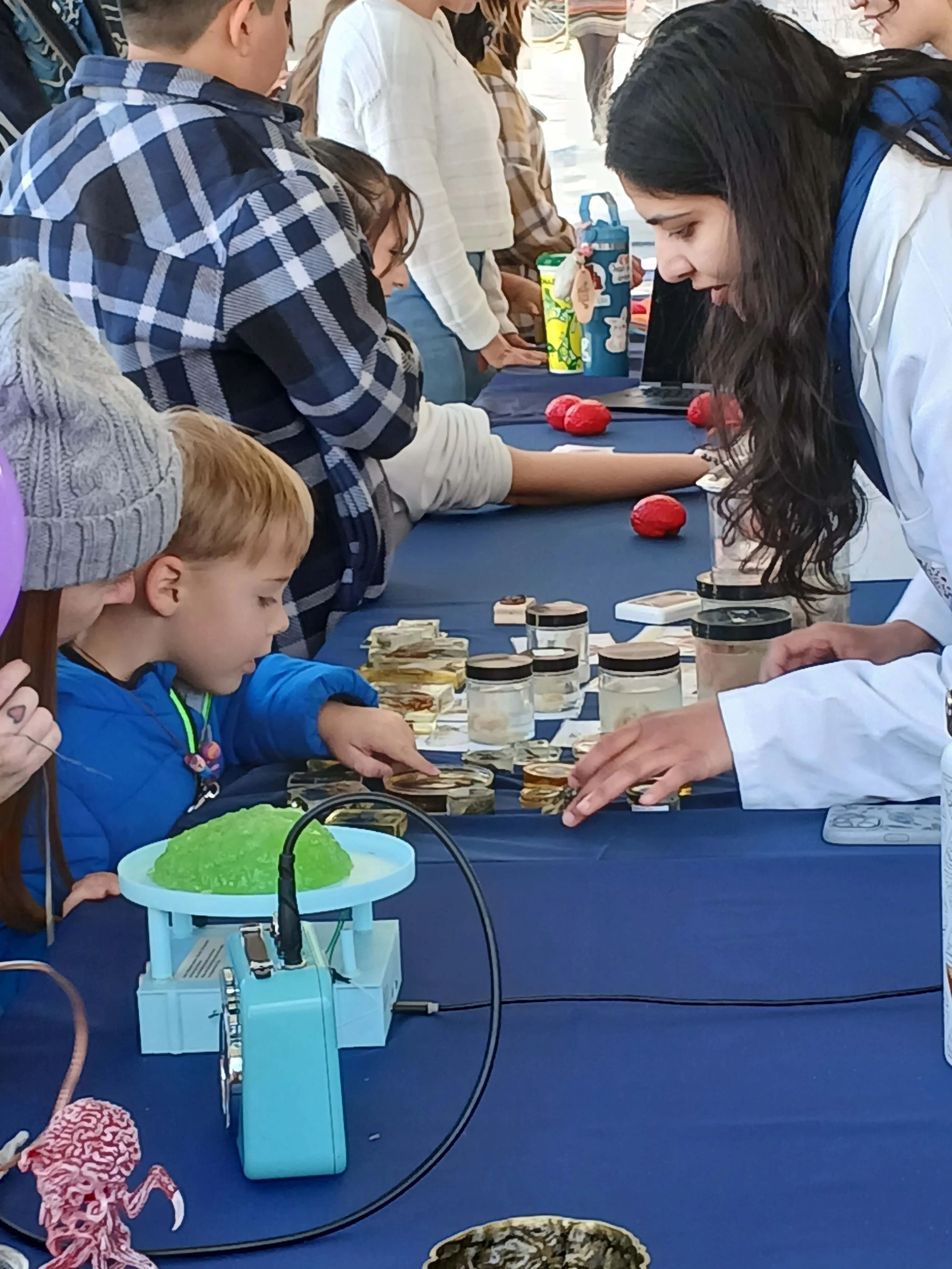 Neuroscience Graduate Student at Science city interacting with young childen